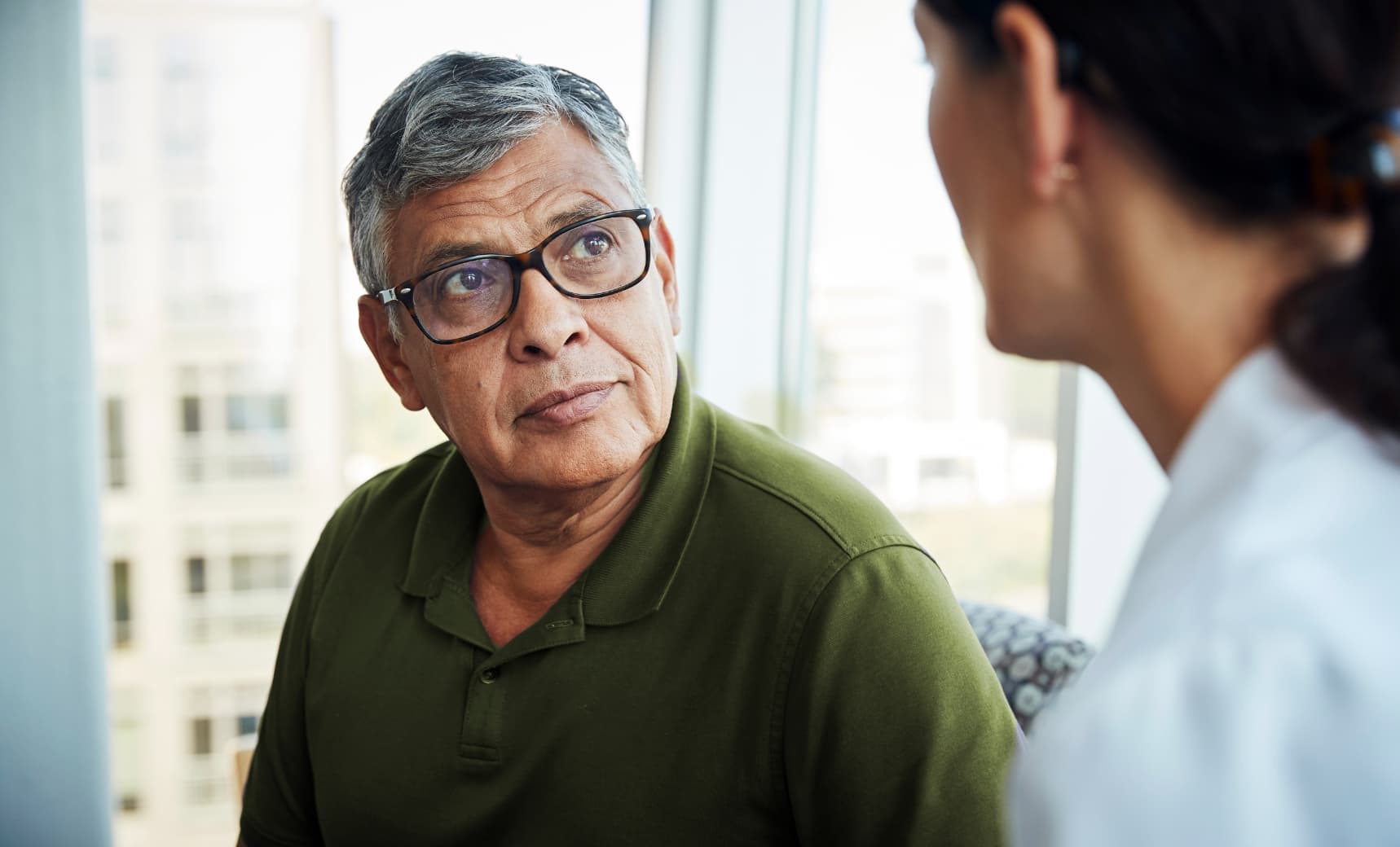 Man talking to doctor